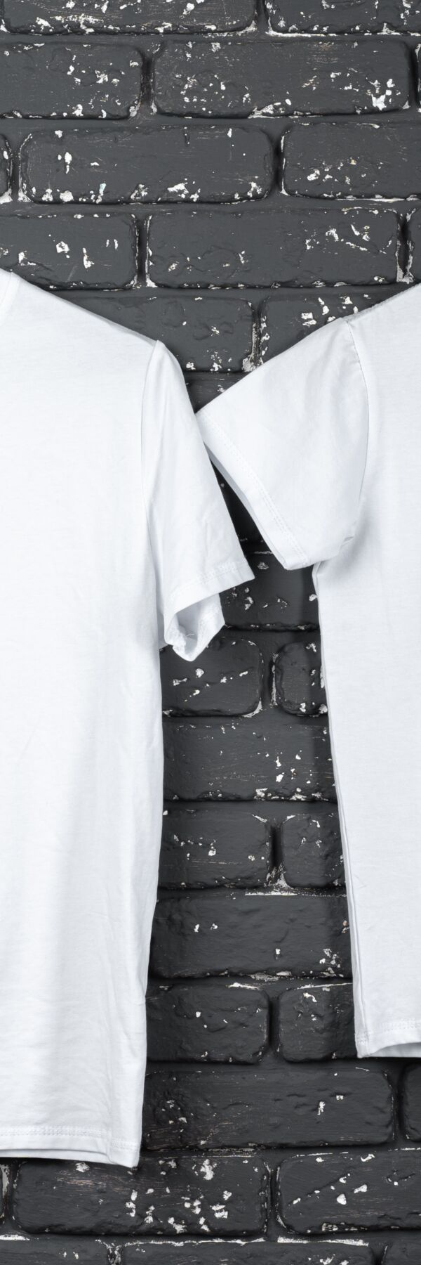 white-t-shirt-hanging-on-hanger-against-brick-wall-2024-09-13-17-06-58-utc.jpg Thumbnail
